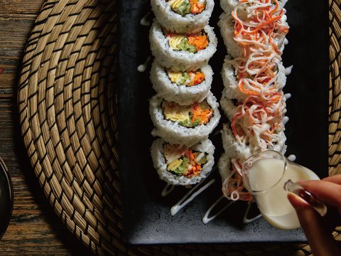 Prepared seafood rolls on a serving board