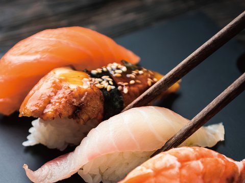 Assorted nigiri on a slate board